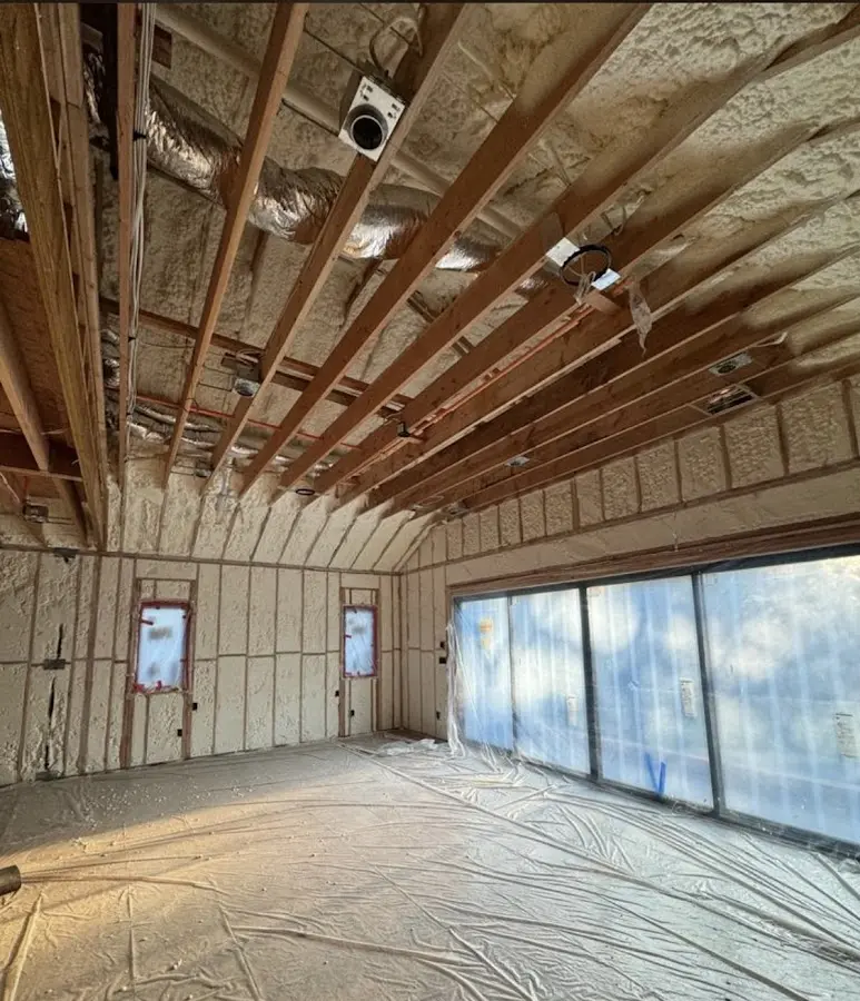 Interior walls and ceiling insulated with spray foam during new construction in Kittery